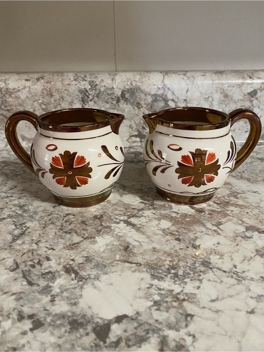 Pair of Cream and Brown Floral Ceramic Creamers with Copper LusterTrim. Vintage